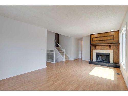 319 Ranchview Mews Nw, Calgary, AB - Indoor Photo Showing Living Room With Fireplace