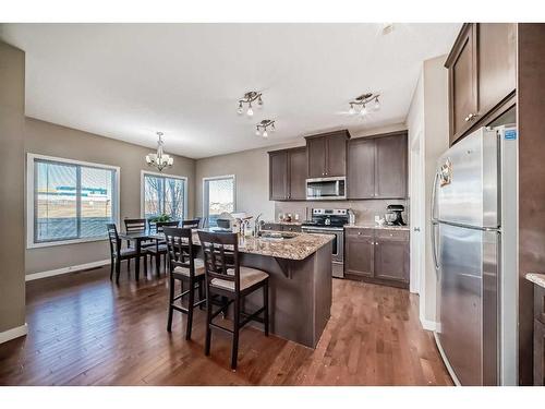 22 Silverado Plains Common Sw, Calgary, AB - Indoor Photo Showing Kitchen With Fireplace With Double Sink