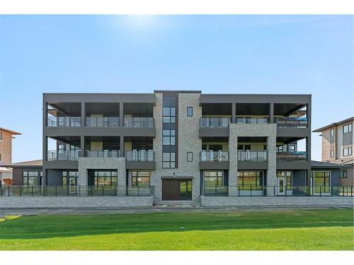 301-120 Marina Cove Se, Calgary, AB - Outdoor With Facade