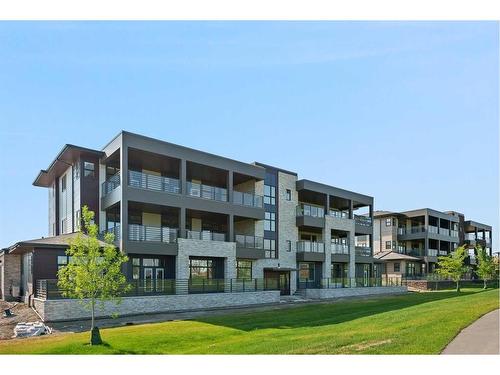 301-120 Marina Cove Se, Calgary, AB - Outdoor With Facade