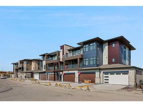 301-120 Marina Cove Se, Calgary, AB - Outdoor With Facade