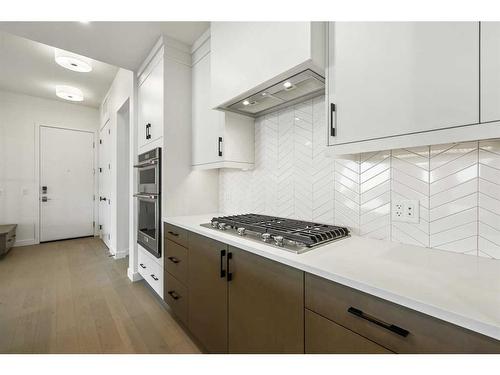 301-120 Marina Cove Se, Calgary, AB - Indoor Photo Showing Kitchen With Upgraded Kitchen