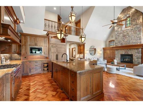 3 Aspen Ridge Court Sw, Calgary, AB - Indoor Photo Showing Kitchen With Fireplace With Upgraded Kitchen