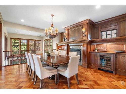 3 Aspen Ridge Court Sw, Calgary, AB - Indoor Photo Showing Dining Room With Fireplace