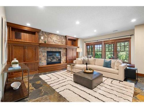 3 Aspen Ridge Court Sw, Calgary, AB - Indoor Photo Showing Living Room With Fireplace