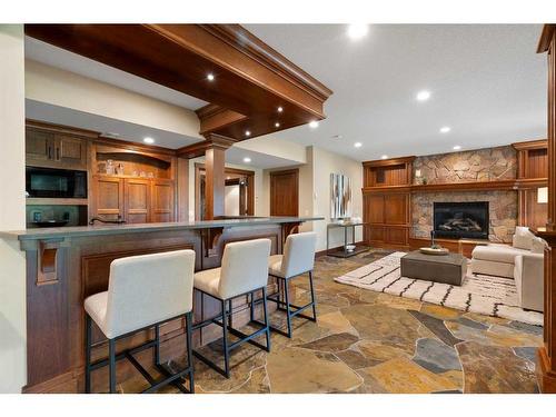 3 Aspen Ridge Court Sw, Calgary, AB - Indoor With Fireplace