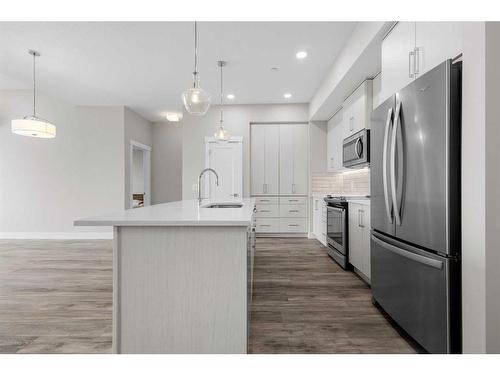 312-38 Quarry Gate Se, Calgary, AB - Indoor Photo Showing Kitchen With Upgraded Kitchen