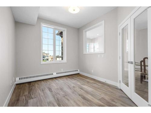 312-38 Quarry Gate Se, Calgary, AB - Indoor Photo Showing Other Room