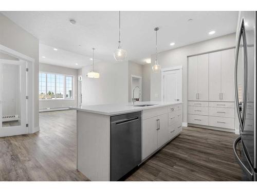 312-38 Quarry Gate Se, Calgary, AB - Indoor Photo Showing Kitchen With Upgraded Kitchen