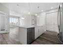 312-38 Quarry Gate Se, Calgary, AB  - Indoor Photo Showing Kitchen With Upgraded Kitchen 