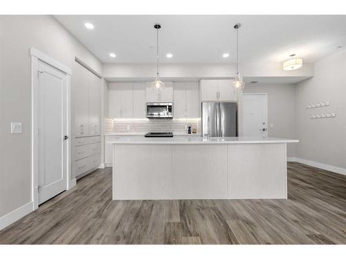 312-38 Quarry Gate Se, Calgary, AB - Indoor Photo Showing Kitchen With Upgraded Kitchen