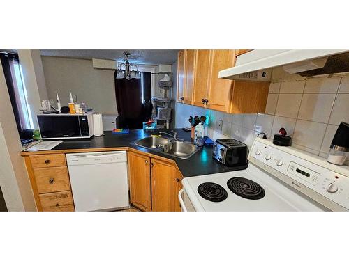 204-6825 Centre Street Nw, Calgary, AB - Indoor Photo Showing Kitchen With Double Sink