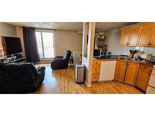 204-6825 Centre Street Nw, Calgary, AB - Indoor Photo Showing Kitchen With Double Sink