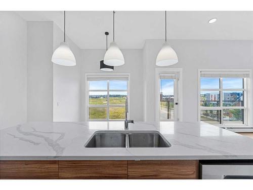 412-19621 40 Street, Calgary, AB - Indoor Photo Showing Kitchen With Double Sink