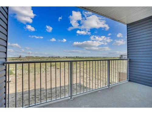 604-33 Merganser Drive, Chestermere, AB - Outdoor With Balcony With View With Exterior