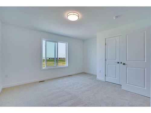 604-33 Merganser Drive, Chestermere, AB - Indoor Photo Showing Other Room