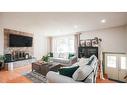 127 Ranchview Mews Nw, Calgary, AB  - Indoor Photo Showing Living Room With Fireplace 