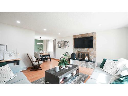 127 Ranchview Mews Nw, Calgary, AB - Indoor Photo Showing Living Room With Fireplace