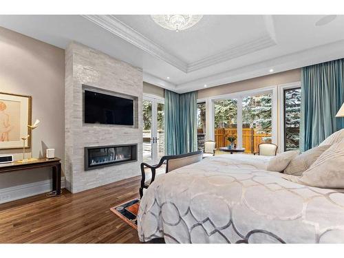 1020 Bel-Aire Drive Sw, Calgary, AB - Indoor Photo Showing Bedroom With Fireplace