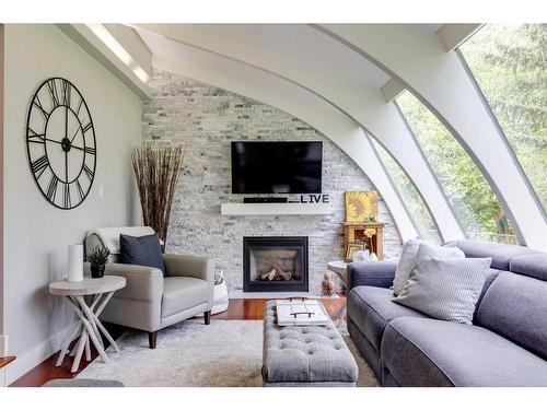 916 Mapleglade Drive Se, Calgary, AB - Indoor Photo Showing Living Room With Fireplace