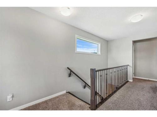 157 Sunset Point, Cochrane, AB - Indoor Photo Showing Other Room