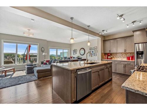 157 Sunset Point, Cochrane, AB - Indoor Photo Showing Kitchen With Stainless Steel Kitchen With Upgraded Kitchen