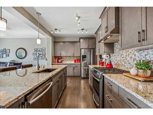 157 Sunset Point, Cochrane, AB - Indoor Photo Showing Kitchen With Stainless Steel Kitchen With Upgraded Kitchen