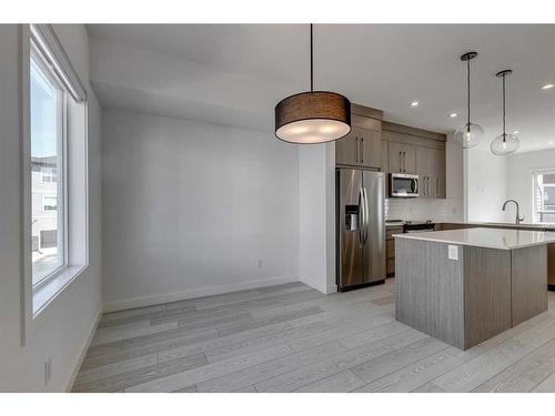 402-280 Chelsea Road, Chestermere, AB - Indoor Photo Showing Kitchen With Stainless Steel Kitchen With Upgraded Kitchen