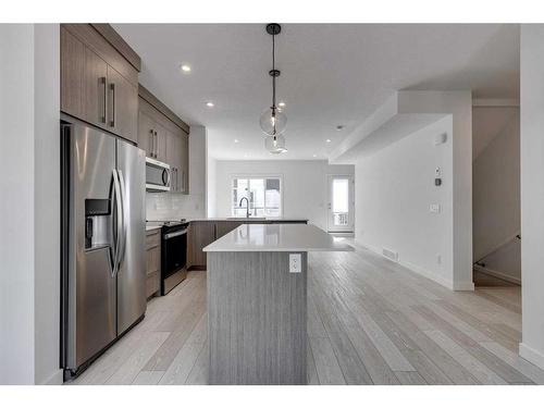 402-280 Chelsea Road, Chestermere, AB - Indoor Photo Showing Kitchen With Stainless Steel Kitchen With Upgraded Kitchen