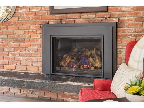 456 Wilderness Drive Se, Calgary, AB - Indoor Photo Showing Living Room With Fireplace