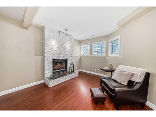 124 Shawinigan Drive Sw, Calgary, AB - Indoor Photo Showing Living Room With Fireplace
