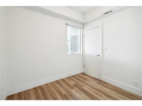 707-1087 2 Avenue Nw, Calgary, AB - Indoor Photo Showing Other Room