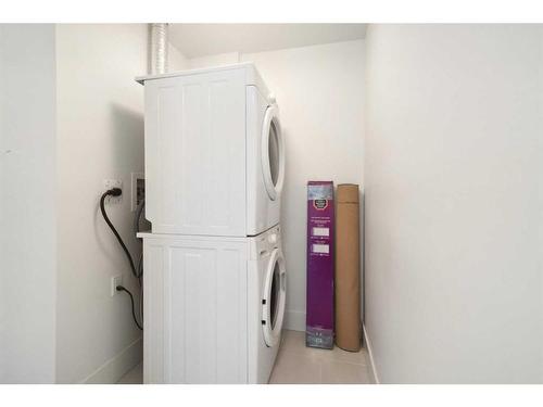 707-1087 2 Avenue Nw, Calgary, AB - Indoor Photo Showing Laundry Room