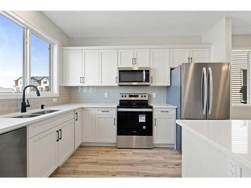 119 Dawson Wharf Rise, Chestermere, AB - Indoor Photo Showing Kitchen With Double Sink