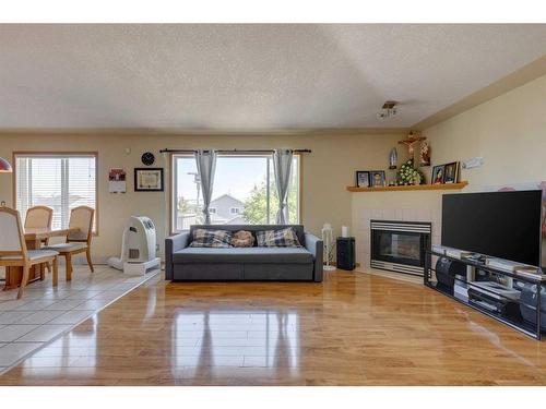 244 Fresno Place Ne, Calgary, AB - Indoor Photo Showing Living Room With Fireplace