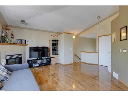 244 Fresno Place Ne, Calgary, AB - Indoor Photo Showing Living Room With Fireplace