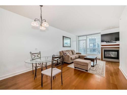 1726-222 Riverfront Avenue Sw, Calgary, AB - Indoor Photo Showing Living Room With Fireplace