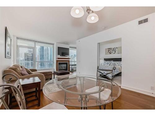 1726-222 Riverfront Avenue Sw, Calgary, AB - Indoor With Fireplace