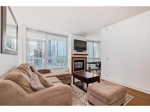 1726-222 Riverfront Avenue Sw, Calgary, AB - Indoor Photo Showing Living Room With Fireplace