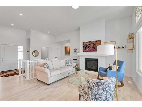 21 Cimarron Estates Gate, Okotoks, AB - Indoor Photo Showing Living Room With Fireplace