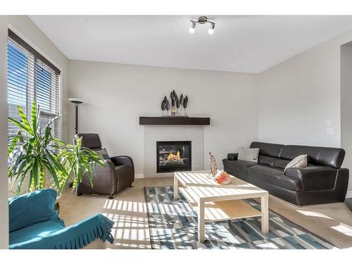 61 Sherwood Heights Nw, Calgary, AB - Indoor Photo Showing Living Room With Fireplace