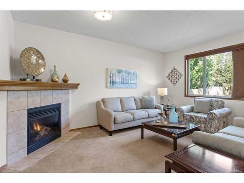 68 Cranfield Gardens Se, Calgary, AB - Indoor Photo Showing Living Room With Fireplace