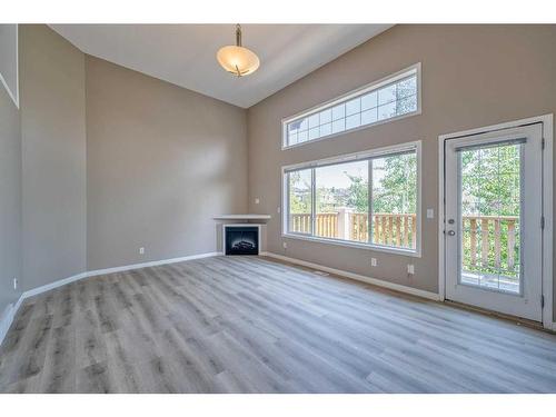 115 Hidden Creek Cove Nw, Calgary, AB - Indoor With Fireplace