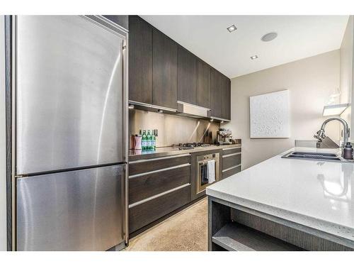 B-1312 Gladstone Road Nw, Calgary, AB - Indoor Photo Showing Kitchen With Stainless Steel Kitchen With Double Sink With Upgraded Kitchen