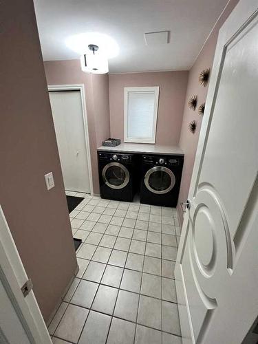 65 Shawnee Crescent Sw, Calgary, AB - Indoor Photo Showing Laundry Room