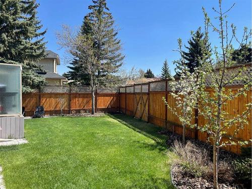 65 Shawnee Crescent Sw, Calgary, AB - Outdoor With Backyard