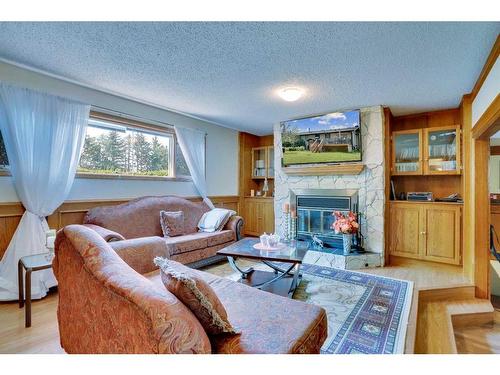 42 Lake Ere Estates, Chestermere, AB - Indoor Photo Showing Living Room With Fireplace