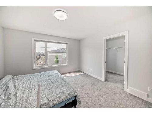 22 Amblehurst Way Nw, Calgary, AB - Indoor Photo Showing Bedroom