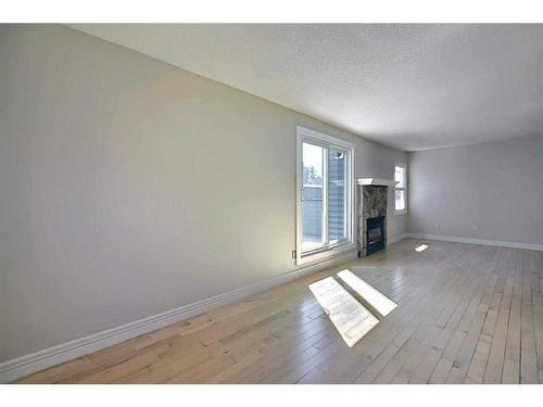 279-86 Glamis Green Sw, Calgary, AB - Indoor With Fireplace