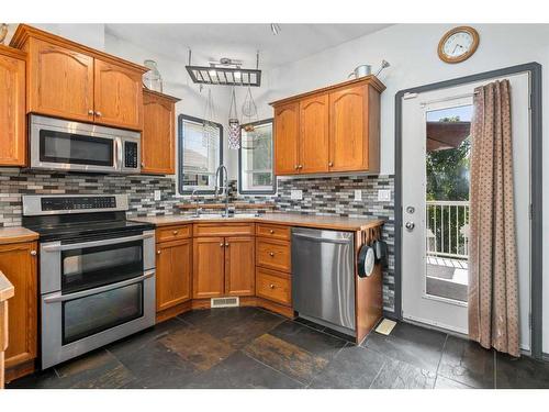 27 Ratcliffe Street, Red Deer, AB - Indoor Photo Showing Kitchen With Double Sink